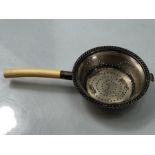 Silver hallmarked tea strainer Sheffield 1908 by Mappin & Webb with bone handle