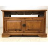 Pine TV unit with shelf and cupboard under, on castors