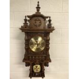 DOLD Schwarzwalduhren Black Forest chiming wall clock approx 98cm in height, with carved pediment,
