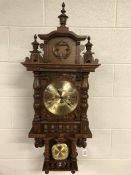 DOLD Schwarzwalduhren Black Forest chiming wall clock approx 98cm in height, with carved pediment,