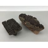 Two carved wooden print blocks with floral design and a frieze design, largest approx 19cm in