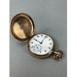 Dennison: a full hunter 9ct gold pocket watch with 9ct inner casing , the dial set with black Arabic