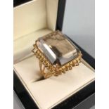 Wire work unmarked Gold ring set with a single large Emerald cut pale yellow Citrine approx.