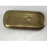Late 18thC brass tobacco box with rounded ends having embossed almanac and calendar design, dated