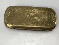 Late 18thC brass tobacco box with rounded ends having embossed almanac and calendar design, dated