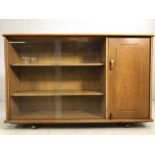 Vintage mid-century sideboard with three glass fronted shelves and cupboard, on castors, approx