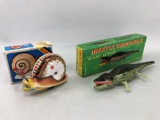 'Inertia Crocodile' tinplate collectors toy, in original box, with key, along with a Chinese Woniu