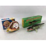 'Inertia Crocodile' tinplate collectors toy, in original box, with key, along with a Chinese Woniu