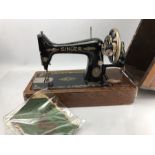 Singer sewing machine in lockable case with original instruction manual