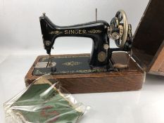 Singer sewing machine in lockable case with original instruction manual
