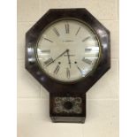 Hexagonal shaped wall clock with pendulum and key by E.Norman of Cheap Street, Sherborne