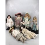 Collection of six porcelain head collectable dolls to include one older musical doll