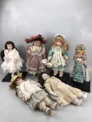 Collection of six porcelain head collectable dolls to include one older musical doll