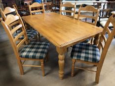 Polished pine kitchen/dining table approx 180cm x 100cm, with six matching chairs with upholstered