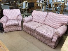 Two-seater sofa and single armchair upholstered in 'ticking' style pink striped fabric