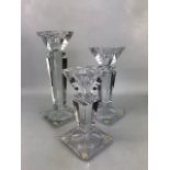 Three modern cut glass graduating candleholders, the tallest approx 30.5cm, the smallest A/F