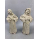 Pair of plaster figures of monks carrying bowls, with hands together, one with hood, approx 25cm