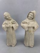 Pair of plaster figures of monks carrying bowls, with hands together, one with hood, approx 25cm