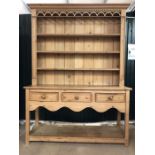 Antique pine dresser with carved detailing, with three drawers under. Approx 152cms x 45cms x 210cms