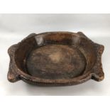 Large rustic wooden bowl / platter with naïve carvings to rim, approx 50cm x 43cm