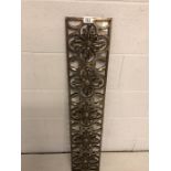 Ornamental cast polished steel grate or decorative fireplace piece depicting flowers, approx 20cm