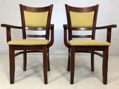 Pair of modern carver chairs with upholstered seats and backs