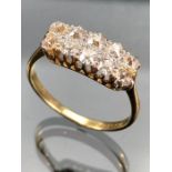 Diamond Ring set with Ten old mine cut Diamonds. Diamonds set in Platinum with 18ct yellow gold ring
