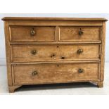 Low antique pine chest of four drawers with brass handles. Approx 104cms x 51cms x 72cms tall