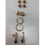 Five pairs of Gold coloured unmarked earrings of various designs