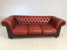 Vintage red leather three seater button-back chesterfield sofa, approx 195cm in length