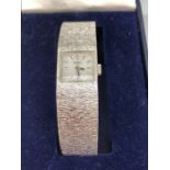 Rotary ladies Silver coloured watch with square face and numbered 212 to reverse in original box