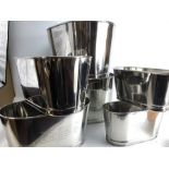 Three pairs of champagne buckets in graduating sizes, the largest pair 26cm tall x 46cm in length,