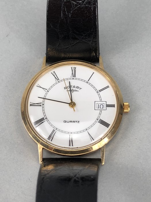 Gents Rotary Quartz Watch with leather strap, White face and date apeture