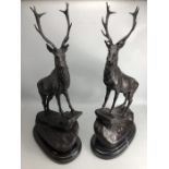 Pair of large bronze figures of stags on stepped marble plinths, approx 75cm in height