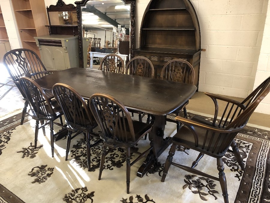 Dining table (possibly Ercol), approx 185cm in length, with six wheel back chairs and two carvers