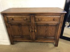 Ercol Old Colonial sideboard with two drawers and cupboard under approx 124cm x 48cm x 84cm tall