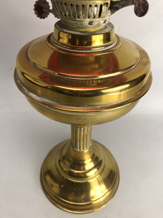 Brass based oil lamp with chimney and cranberry shade - Image 4 of 4