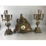 German Imperial Brass mantle clock with Candelabra Garnitures and ceramic inserts (A/F)