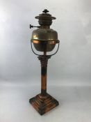 Brass oil lamp on pillared base