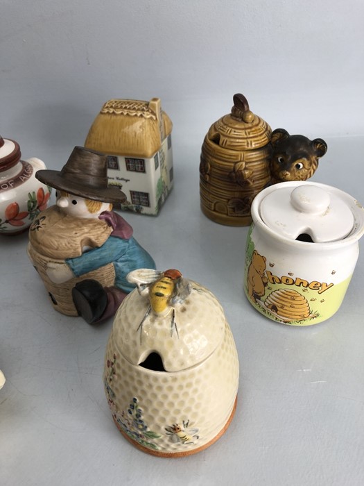 Small collection of eleven honey pots to include one by Price Bros. - Image 2 of 5