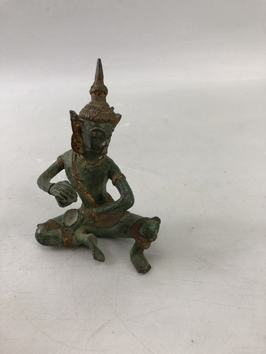 Four oriental items to include Netsuke, seated Buddha and a metal Thai Deity - Image 2 of 7