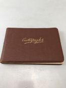 Autograph book to contain sketches, paintings and signatures to include Bob Monkhouse, EF Francis
