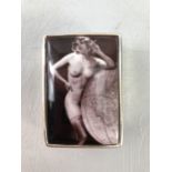 Silver pill box with a smoking nude to lid. Stamped 925