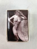 Silver pill box with a smoking nude to lid. Stamped 925