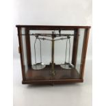 Vintage brass weighing scales in glass case by Philip Harris & Co, Birmingham