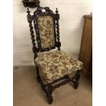 Single oak framed heavily carved upholstered chair with barley twist frame