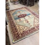 Large red and blue ground rug, approx 195cm x 270cm