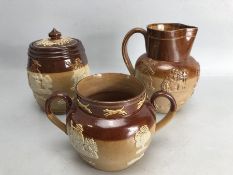Three pieces of Doulton Lambeth stoneware to include a lidded tobacco jar etc
