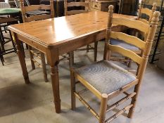 Pine kitchen/dining table, approx 150cm x 77cm, with four matching chairs