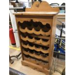 Pine free-standing wine rack to hold 20 bottles, approx 61cm x 37cm x 120cm tall